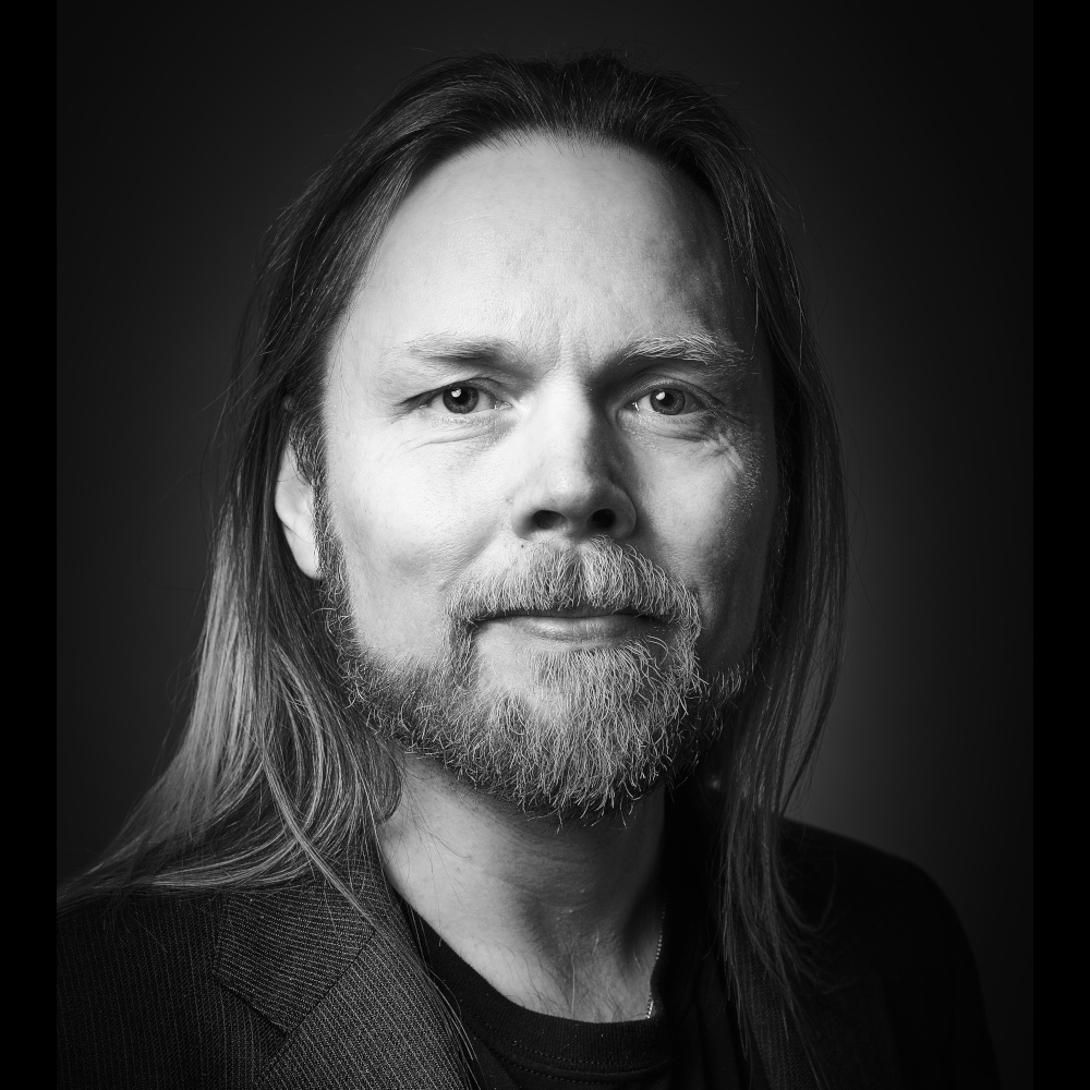 Black and white portrait photo of me, a white male with long hair and a beard
